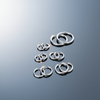 Stainless Steel Hoop and Sleeper Earrings on gloss mirror surface