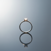 Solitaire Zirconia Ring on gloss mirror surface with baguette ring lighting
