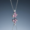 Pink butterfly stainless steel necklace on blue grey gloss background with mirror reflection