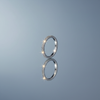 Women's Minimalist Stainless Steel Ring on gloss mirror surface