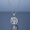 Stainless Steel Tree of Life Necklace on blue grey gloss background